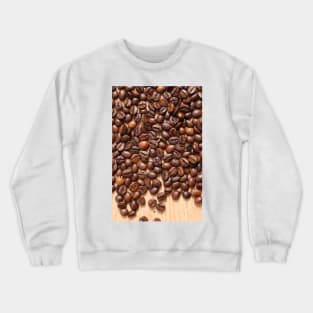 Coffee beans on wood table Crewneck Sweatshirt